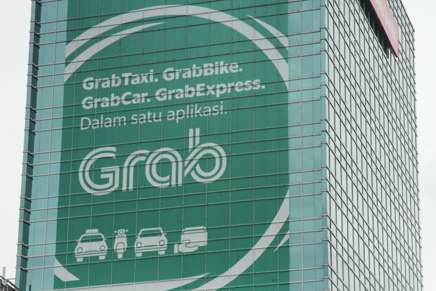 Ilustrasi Grab Taxi. TIRTO/Andrey Gromico