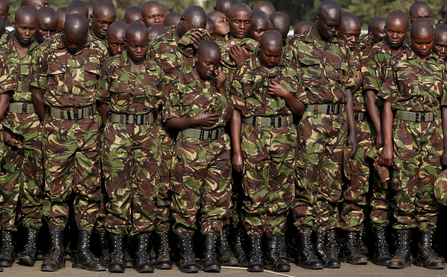 Members of the Kenya Defence Forces attend prayers to pay respects to the Kenyan soldiers serving in the African Union Mission in Somalia (AMISOM), who were killed in El Adde during an attack, at a memorial mass at the Moi Barracks in Eldoret, in this January 27, 2016 file photo. As many as 200 soldiers were killed in an attack on a Kenyan military camp in Somalia by al Shabaab Islamists last month, Somali President Hassan Sheikh Mohamud told a television station, although Kenya rejected the figure. Kenyan authorities have refused to give a death toll following the Jan. 15 raid, which targeted troops working under the African Union Mission in Somalia (AMISOM) near the southern Somali town of El Adde. REUTERS/Thomas Mukoya/Files TPX IMAGES OF THE DAY