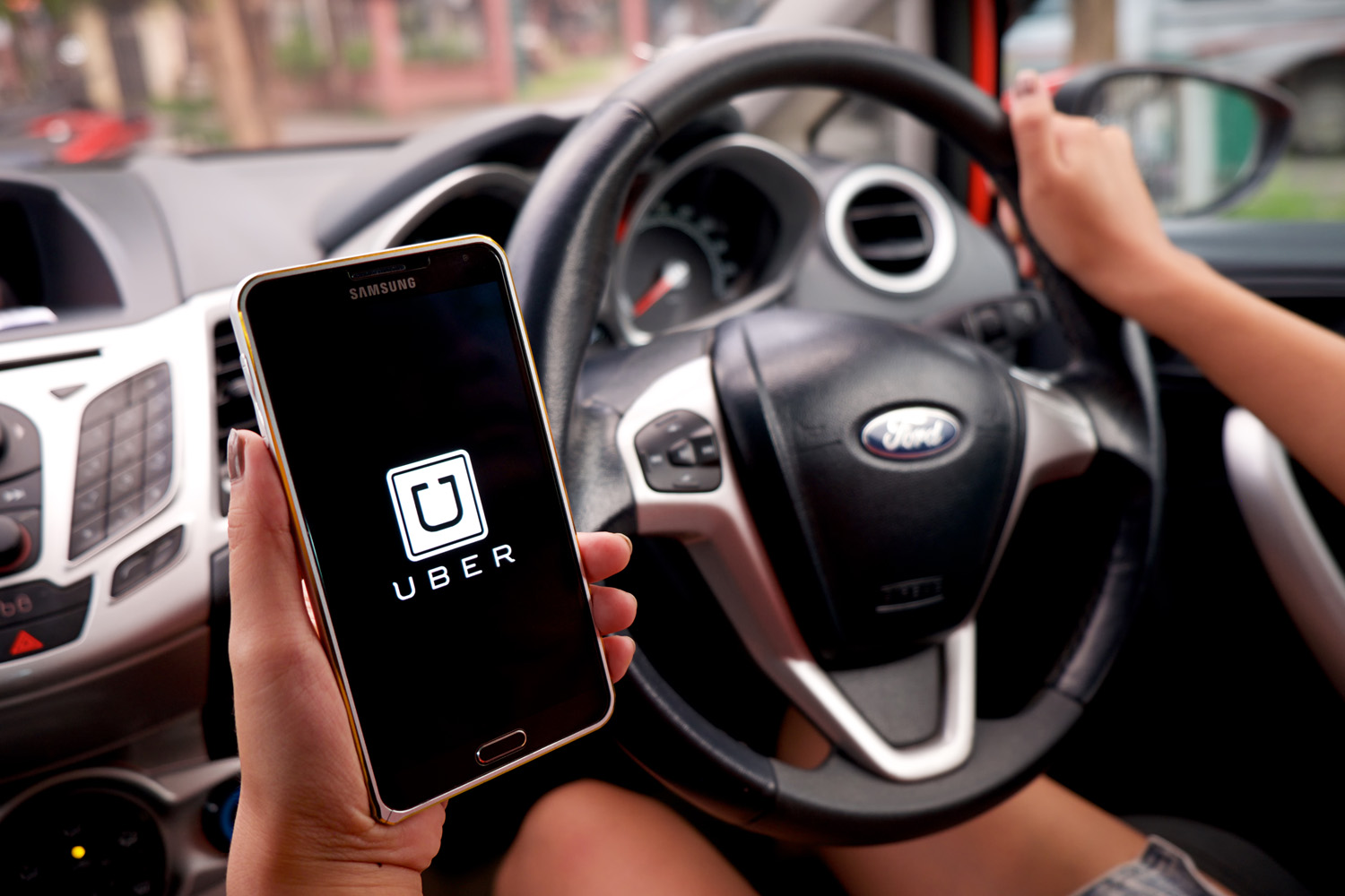 Ilustrasi Uber Taxi. SHUTTERSTOCK