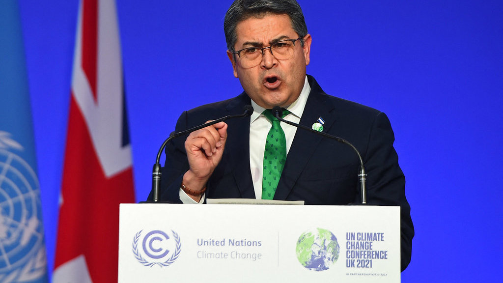 Presiden Honduras Juan Orlando Hernández menyampaikan pernyataan nasionalnya sebagai bagian dari KTT Pemimpin Dunia Konferensi Perubahan Iklim PBB COP26 di Glasgow, Skotlandia pada 1 November 2021. AFP/ ANDY BUCHANAN / POOL Juan Orlando Hernandez