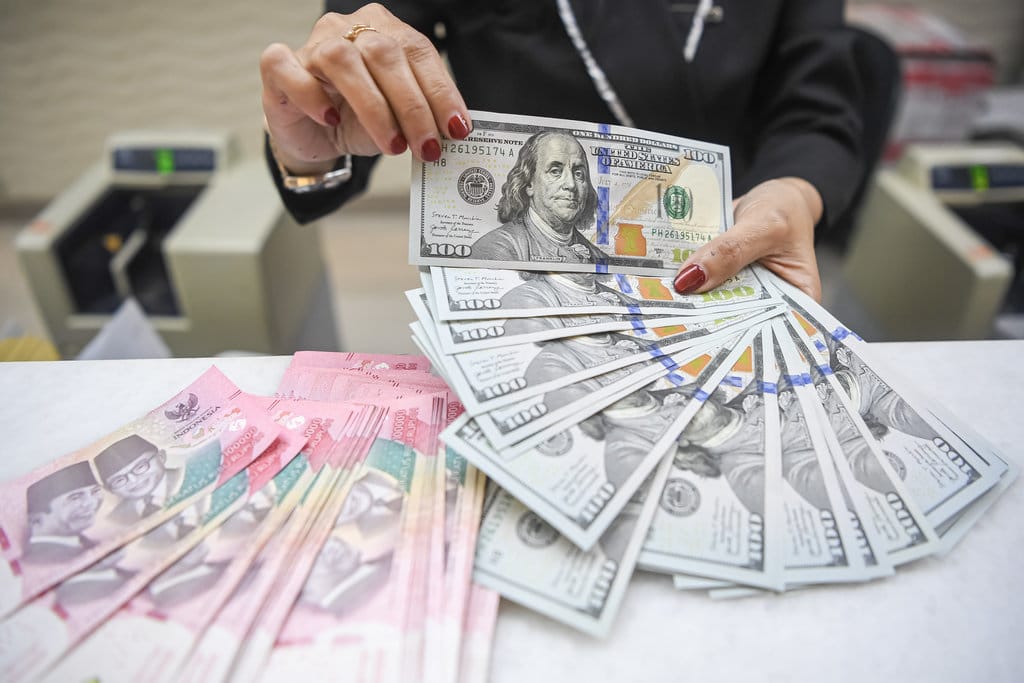 Dinamika Berlawanan Rupiah dan IHSG