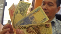 Menyatukan Indonesia dengan Mata Uang
