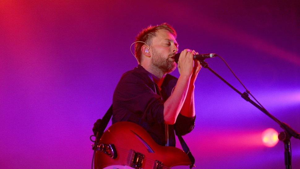 Radiohead Lelang Topi Thom Yorke untuk Amal Kanker